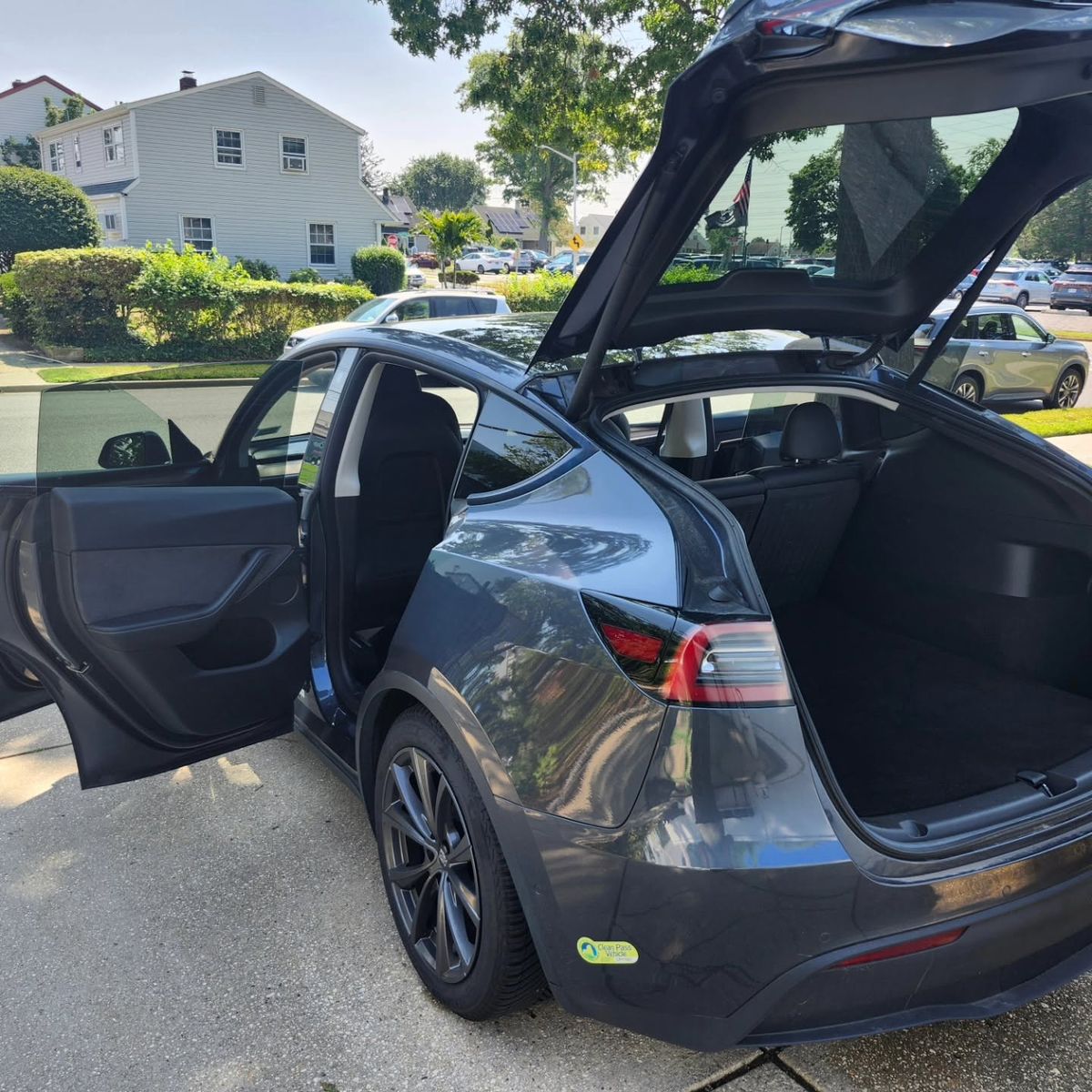 Tesla Model Y with doors and liftgate open, detailed inside and out